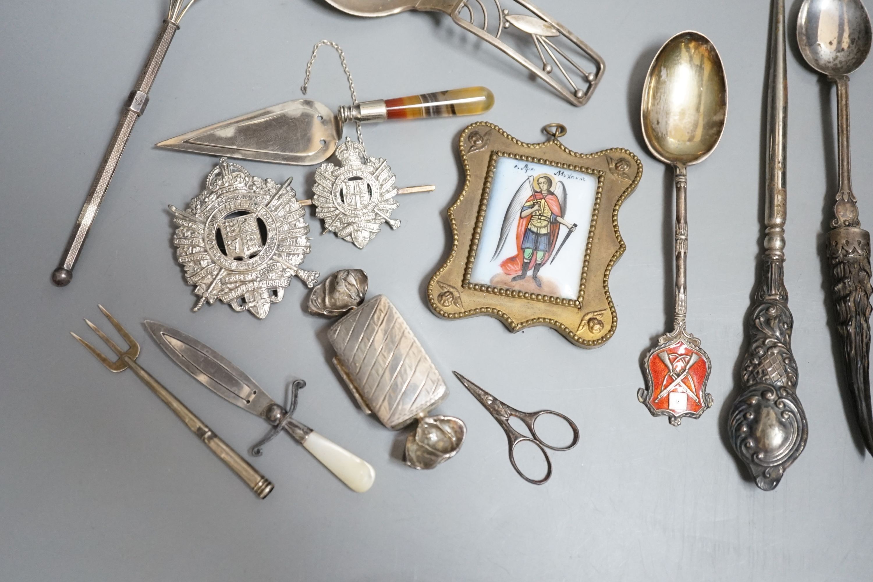 Sundry small silver etc. including a Danish sterling caddy spoon, by Franz Hingelberg, 9.7cm, nephrite handles silver gilt paper knife, swizzle stick, button hook, agate handled trowel bookmark, two badges etc.